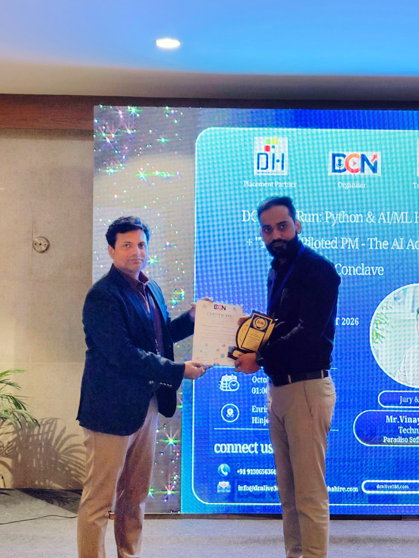 Jury and speakers lead receiving his certificate on stage