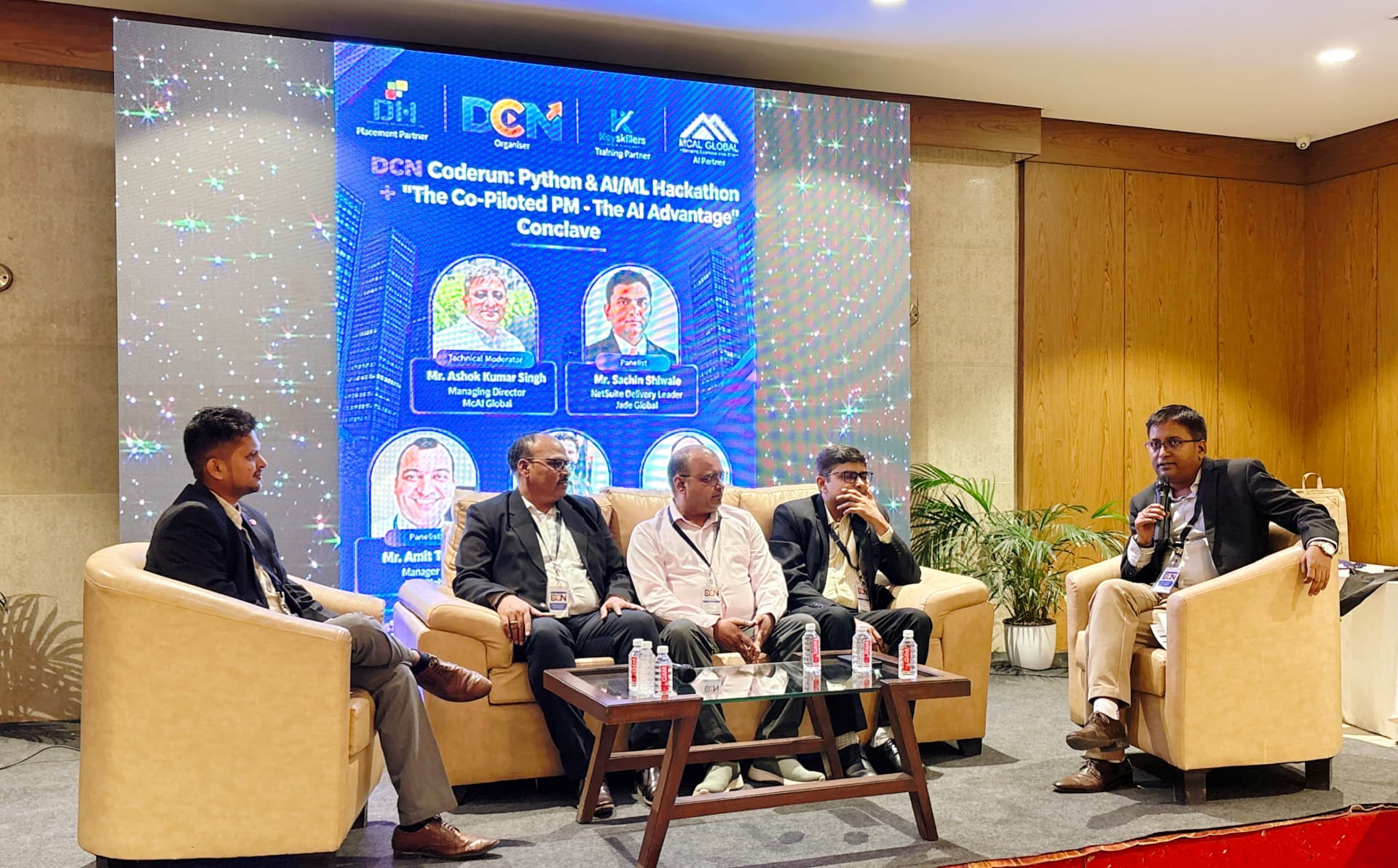 Moderator leading the PM Conclave panel discussion
