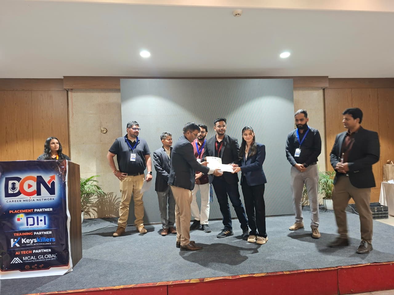 Students receiving certificates on the CodeRun stage